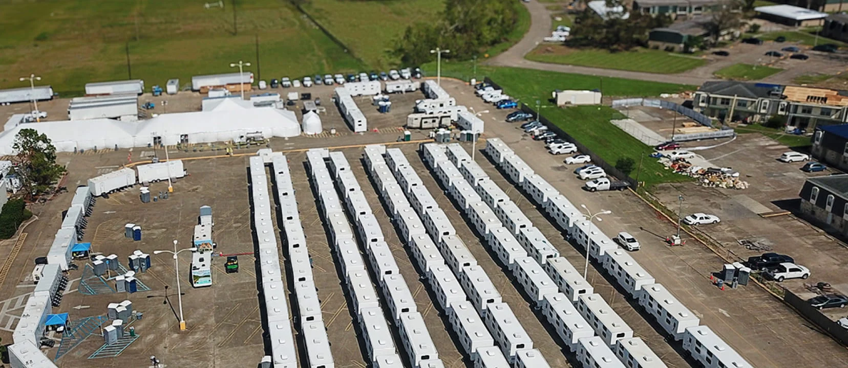 An aerial view of DRG logistics base camp with rows of mobile equipment trailers deployed after Hurricane Francine, 2024.