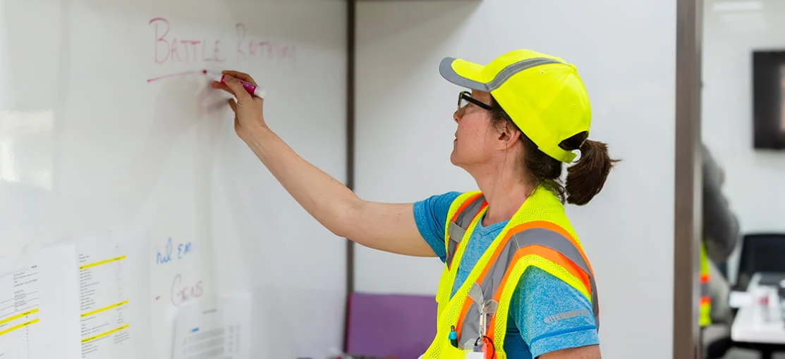 A DRG employee leads a training session.