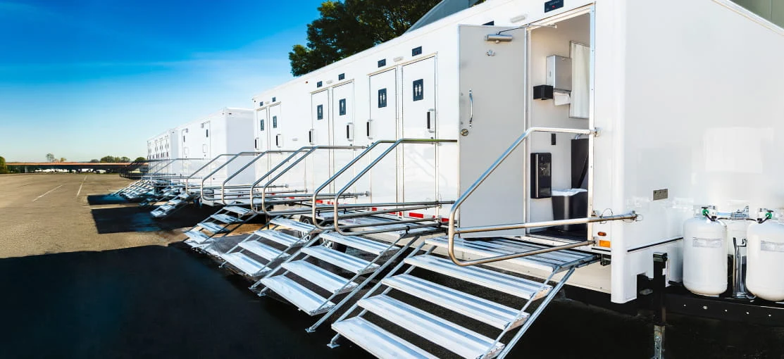 Mobile hygiene trailers with rear steps deployed.
