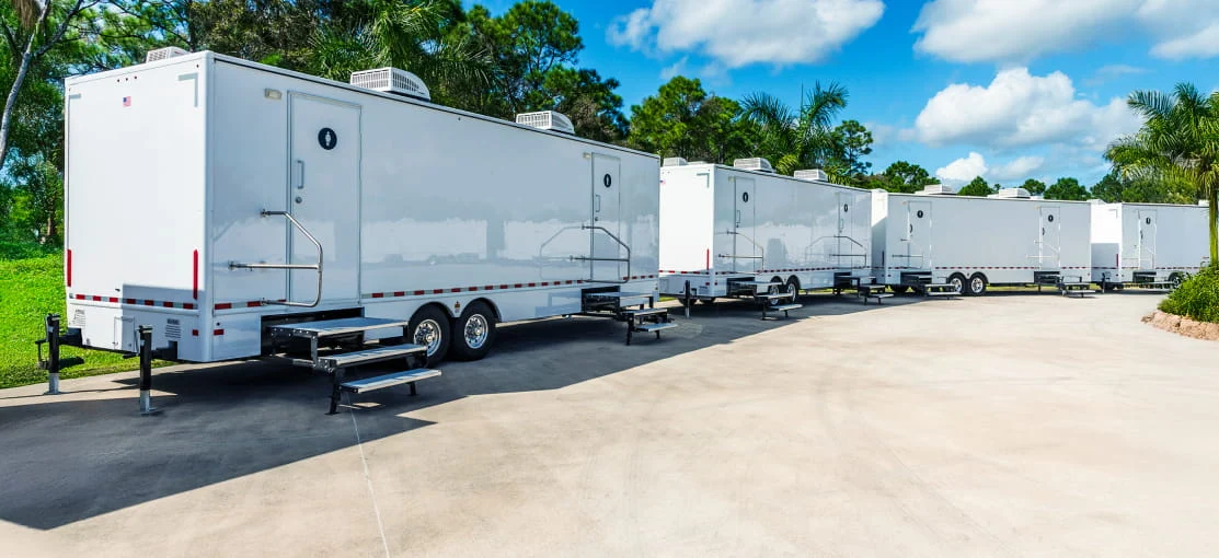 Mobile equipment trailers in a semi-circle.