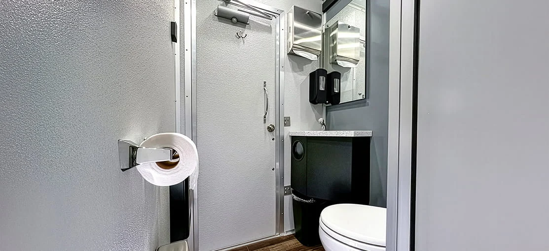 Restroom facilities inside a mobile restroom trailer.
